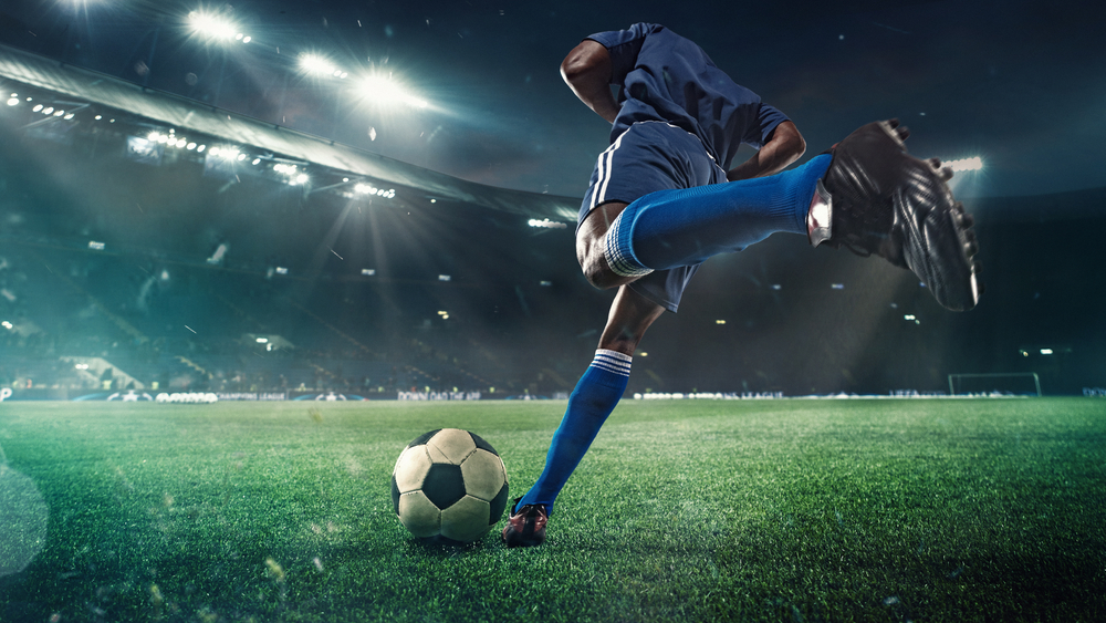 soccer-football-player-stadium-flashlights-kicking ball-winning goal-shut